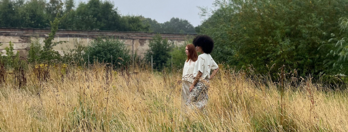 Models amongst grass at photoshoot