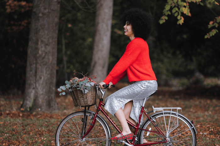 Model in Sequin Dress on bike