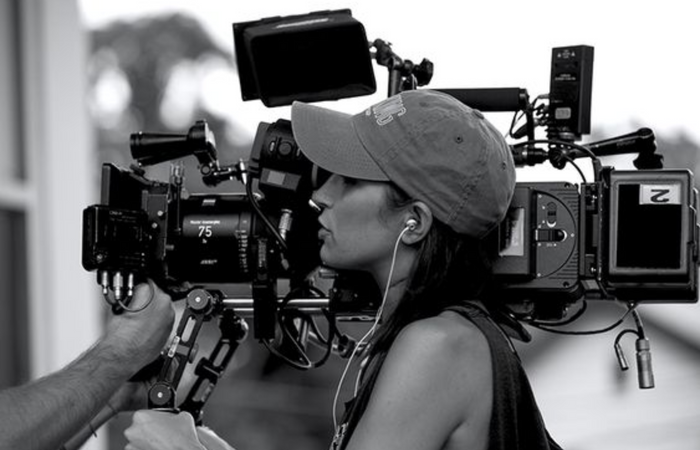 woman holding a film camera
